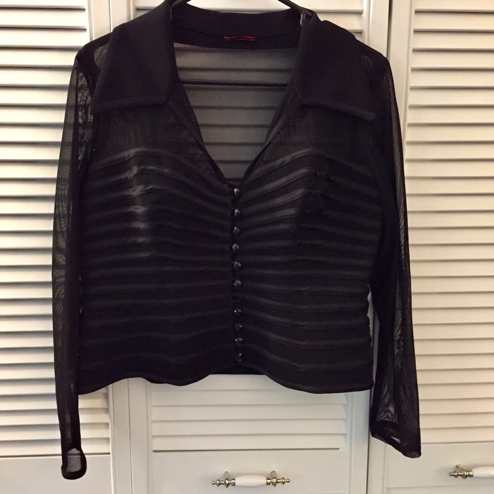 Sexy blouse with sheer mesh sleeves and shoulders.